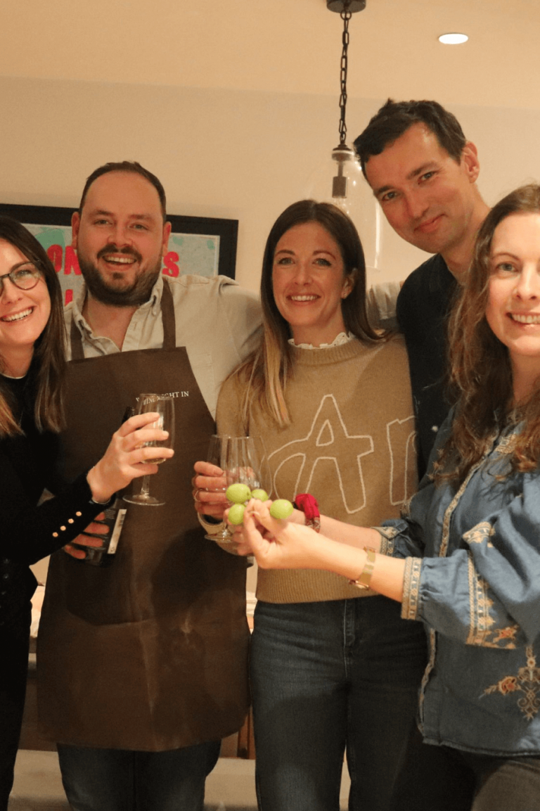 Staged group photo at wine night in