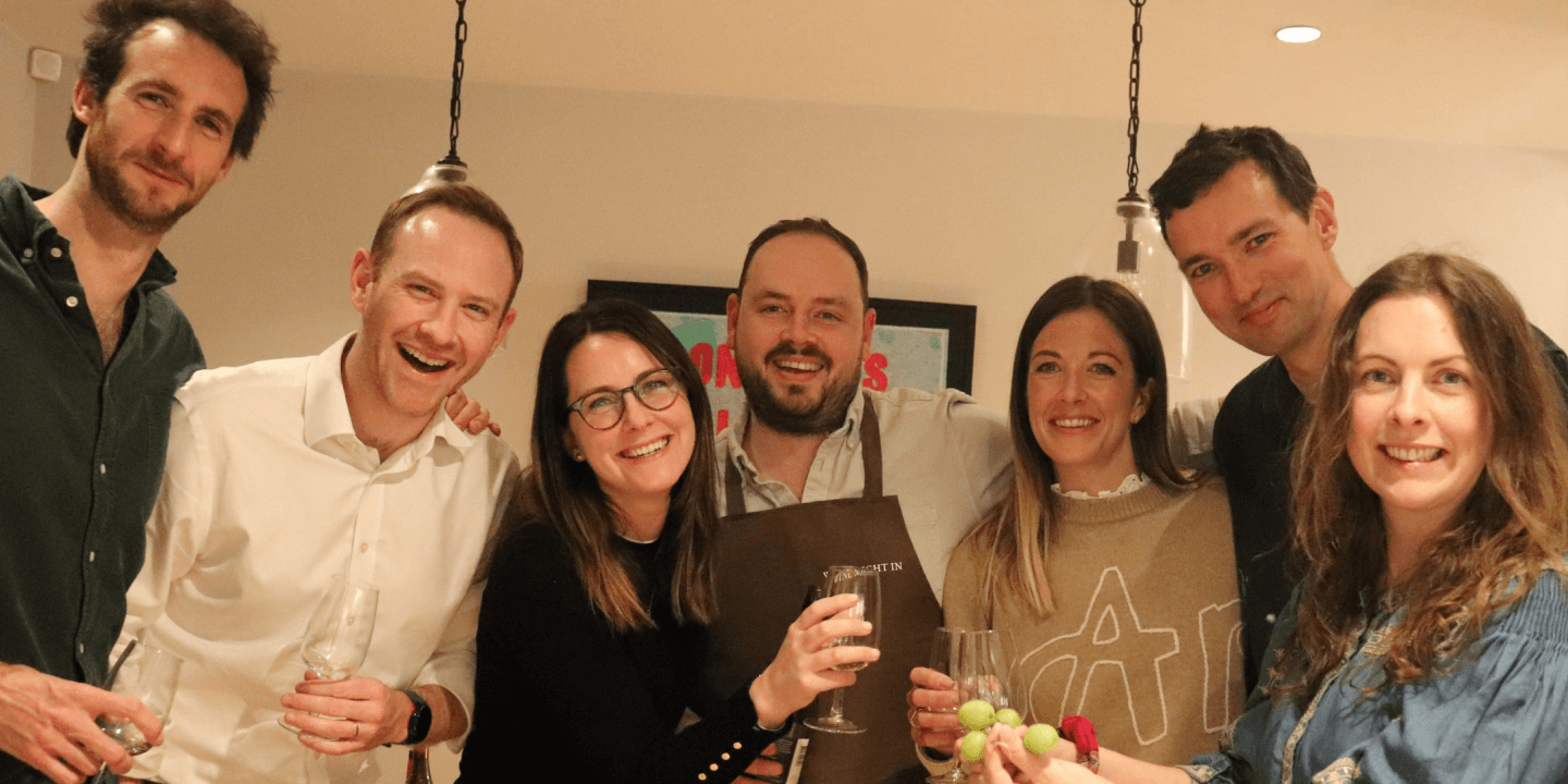 Staged group photo at wine night in