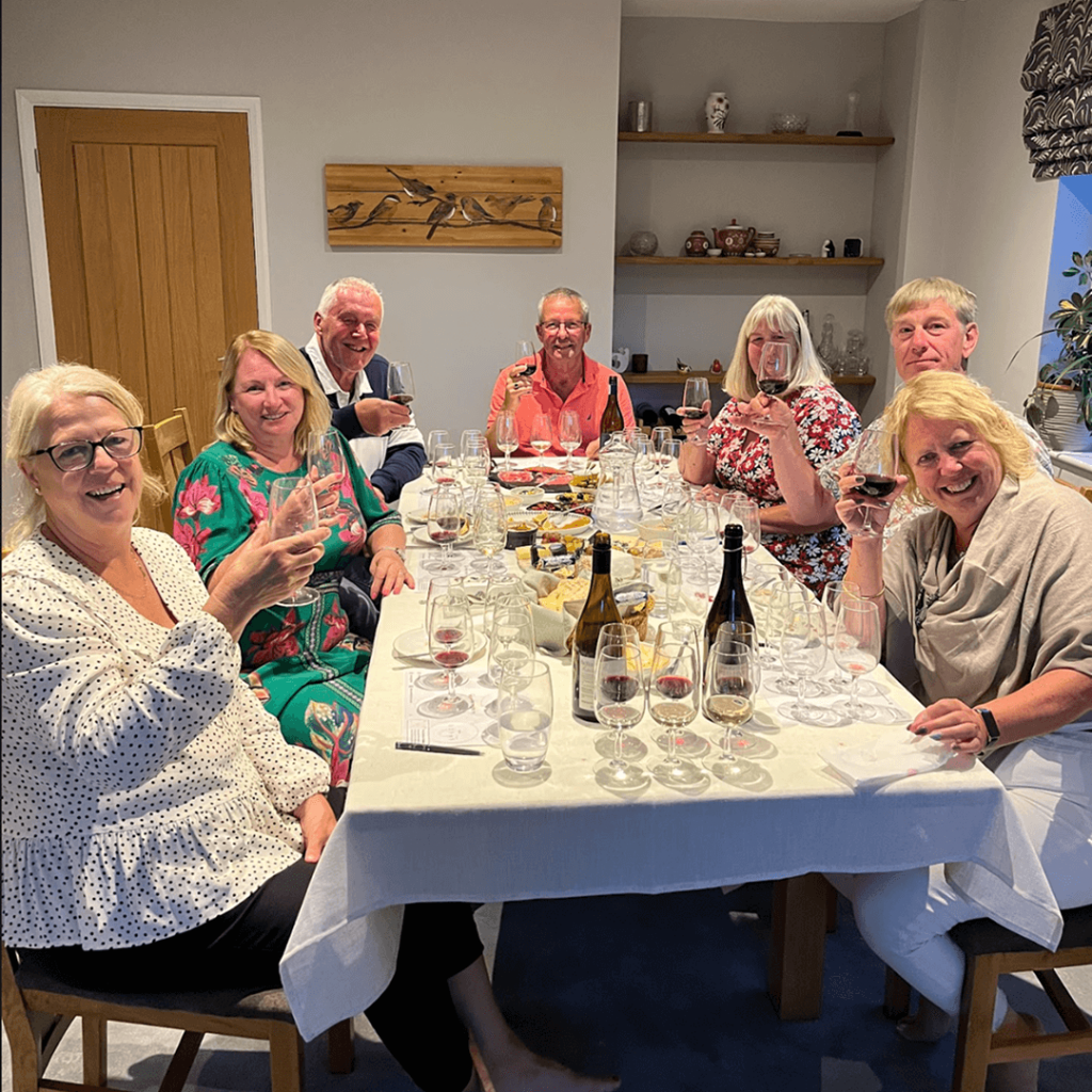 Group celebrating anniversary with wine